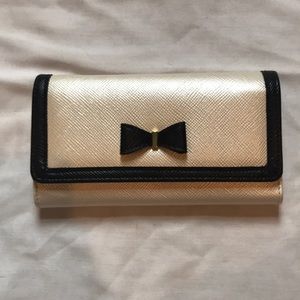 Black and cream colored wallet